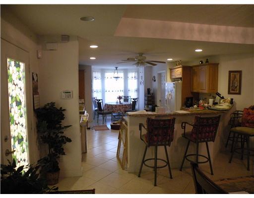 4625 Southwest Inagua Street Port St. Lucie, FL 34953 - Photo 5 of 9 a view of a dining room with furniture