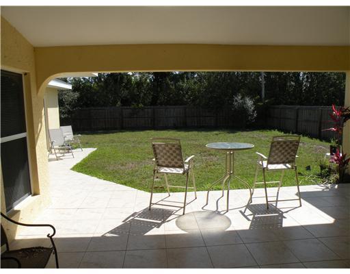 4625 Southwest Inagua Street Port St. Lucie, FL 34953 - Photo 6 of 9 a view of a swimming pool with a patio
