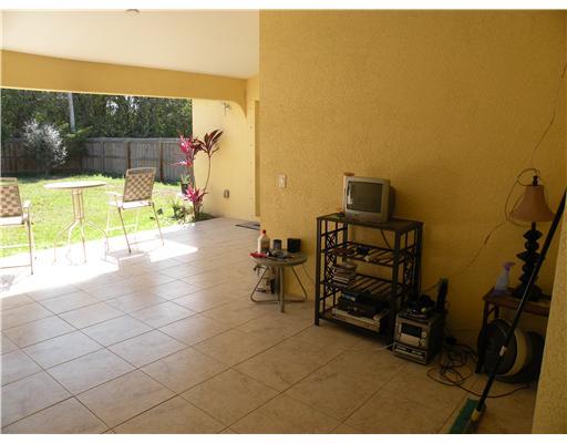 4625 Southwest Inagua Street Port St. Lucie, FL 34953 - Photo 7 of 9 a view of a room with gym equipment