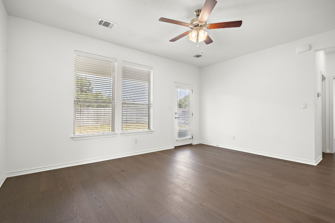 1817 Turtle Bay Loop Leander, TX 78641 - Photo 13 of 38 a view of an empty room with a window and a ceiling fan