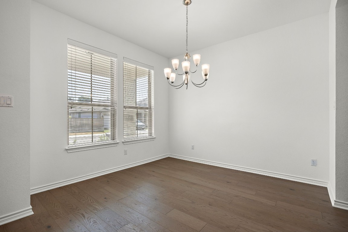 1817 Turtle Bay Loop Leander, TX 78641 - Photo 16 of 38 a view of empty room with wooden floor and fan