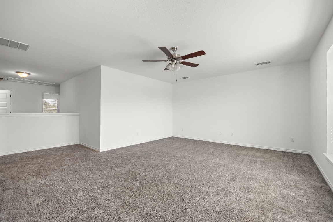 1817 Turtle Bay Loop Leander, TX 78641 - Photo 29 of 38 an empty room with closet and windows