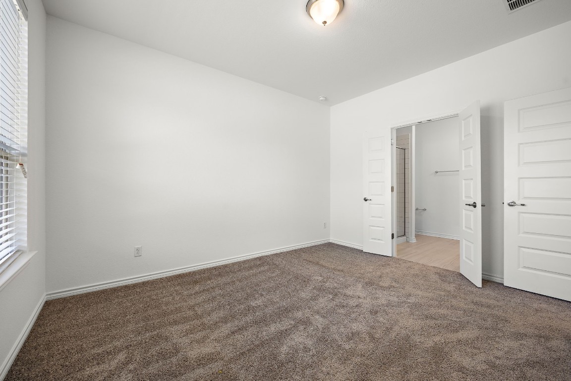 1817 Turtle Bay Loop Leander, TX 78641 - Photo 31 of 38 an empty room with windows