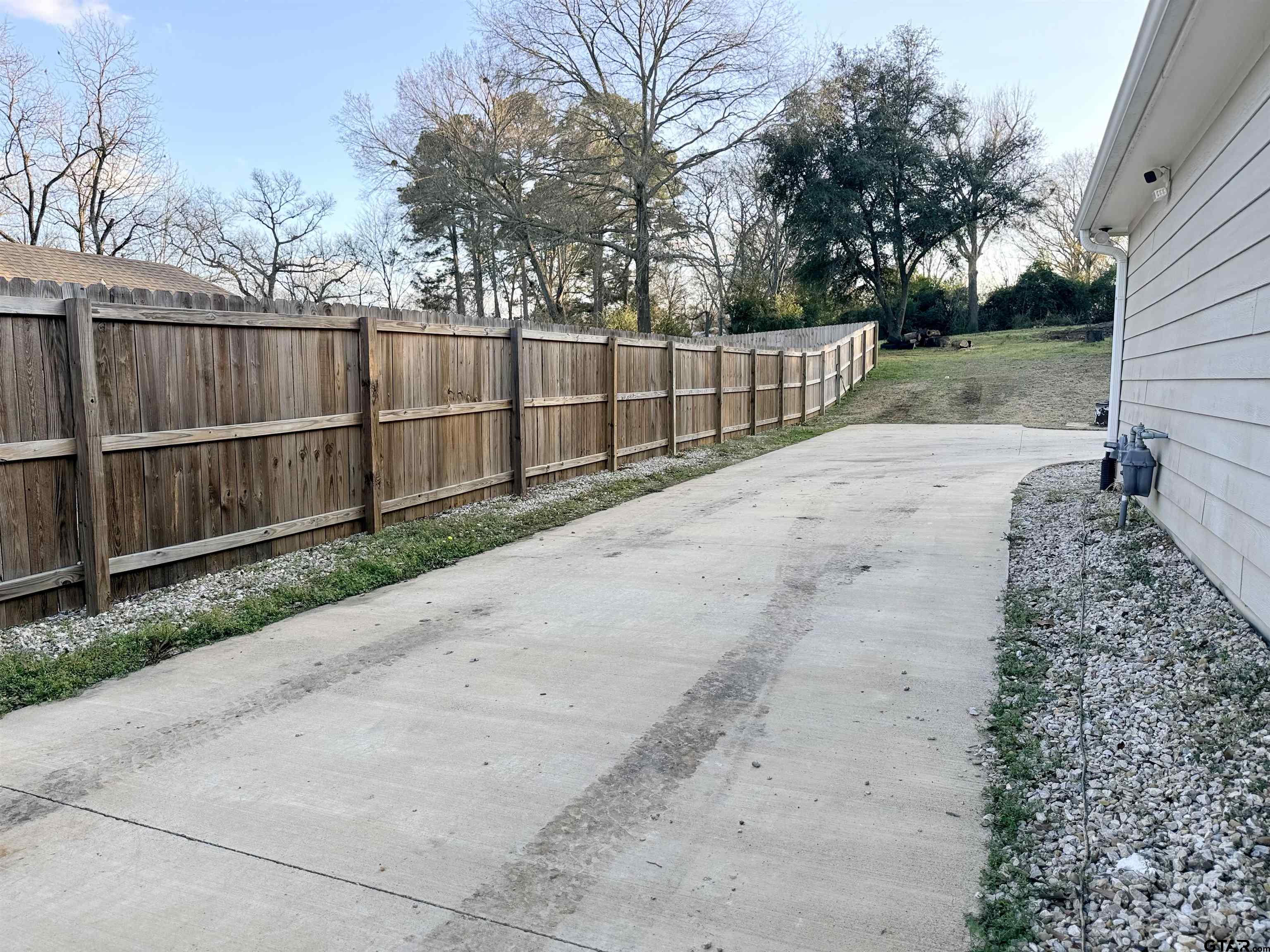 413 Dallas Street Winona, TX 75792 - Photo 32 of 33 a view of a backyard with green space