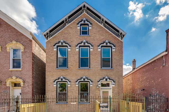 Undisclosed Address Chicago, IL 60608 - Photo 2 of 3 a front view of a house with balcony