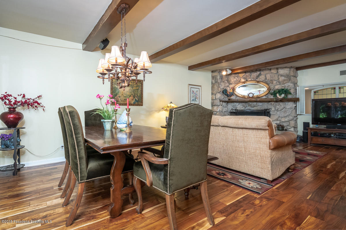 9624 Creemore Drive Tujunga, CA 91042 - Photo 12 of 56 a view of a dining room with furniture and chandelier