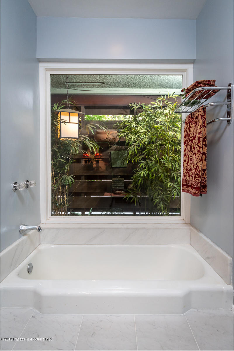 9624 Creemore Drive Tujunga, CA 91042 - Photo 26 of 56 a bathroom with a bathtub and shower