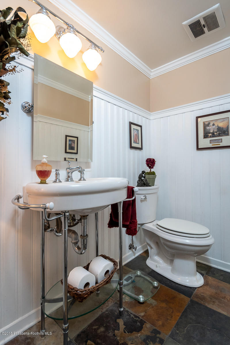 9624 Creemore Drive Tujunga, CA 91042 - Photo 31 of 56 a bathroom with a sink toilet and a mirror