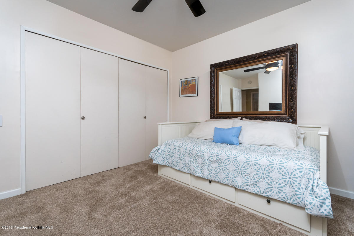 9624 Creemore Drive Tujunga, CA 91042 - Photo 33 of 56 a bedroom with a bed and a large mirror on the dresser