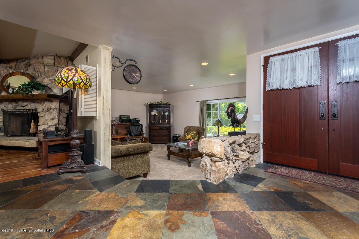 9624 Creemore Drive Tujunga, CA 91042 - Photo 5 of 56 a living room with furniture and a fireplace
