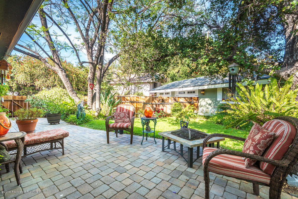 9624 Creemore Drive Tujunga, CA 91042 - Photo 43 of 56 an outdoor sitting area with couch and a bench