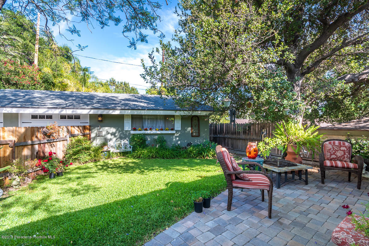 9624 Creemore Drive Tujunga, CA 91042 - Photo 47 of 56 a view of a patio with table and chairs potted plants and large tree