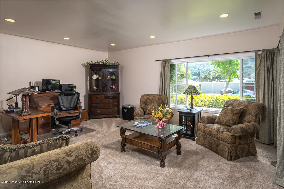 9624 Creemore Drive Tujunga, CA 91042 - Photo 6 of 56 a living room with furniture and a large window