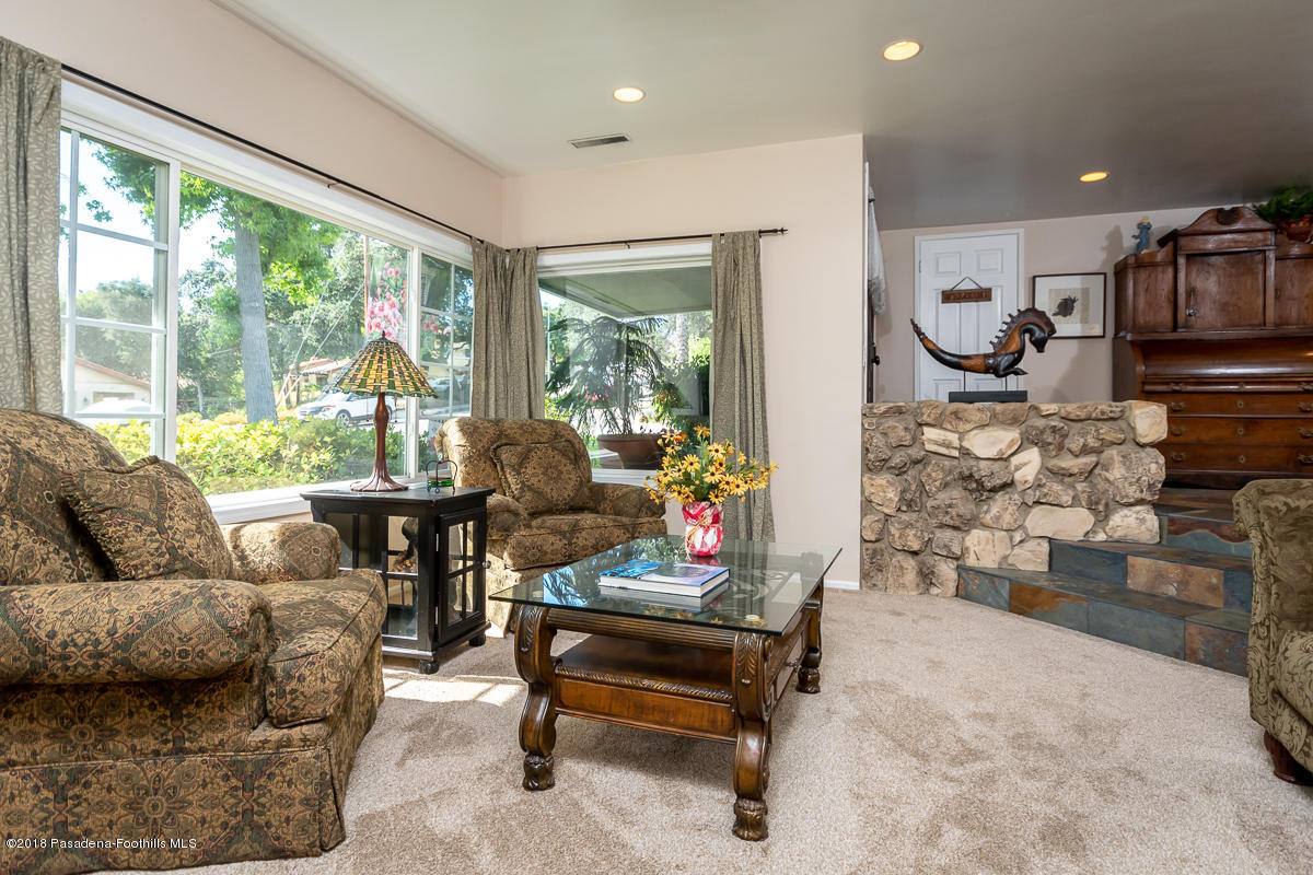 9624 Creemore Drive Tujunga, CA 91042 - Photo 7 of 56 a living room with furniture and a floor to ceiling window