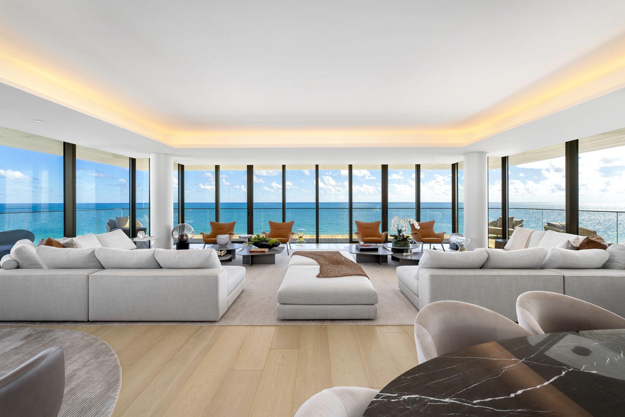 8955 Collins Avenue, Unit LPH Surfside, FL 33154 - Photo 1 of 40 a living room with furniture and a large window