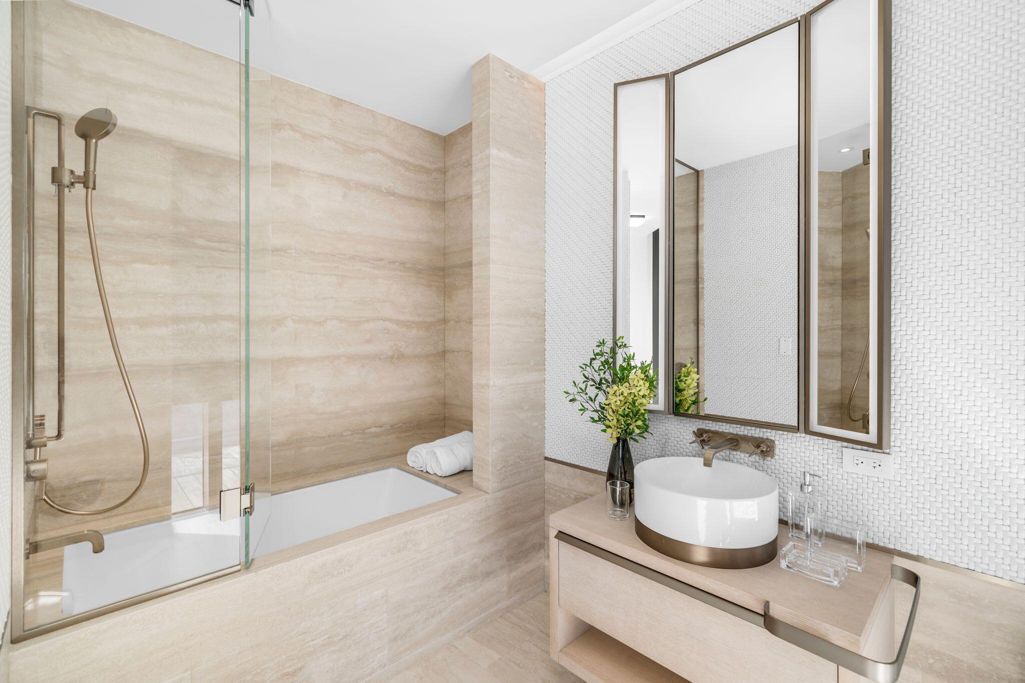 8955 Collins Avenue, Unit LPH Surfside, FL 33154 - Photo 33 of 40 a bathroom with a shower and a sink