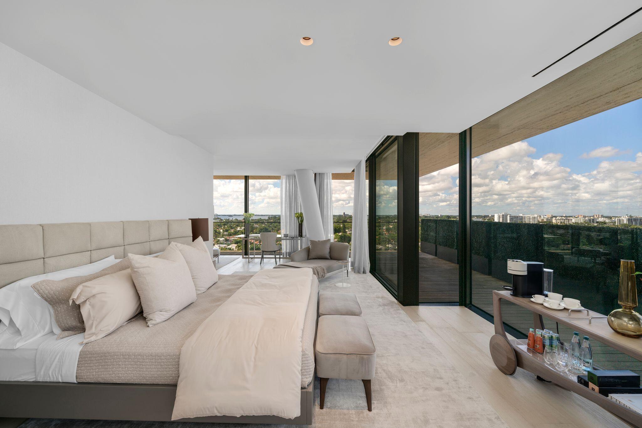 8955 Collins Avenue, Unit LPH Surfside, FL 33154 - Photo 6 of 40 a living room with furniture and a floor to ceiling window