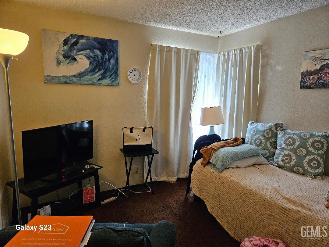 Undisclosed Address San Jose, CA 95111 - Photo 4 of 9 a bedroom with a bed and a television