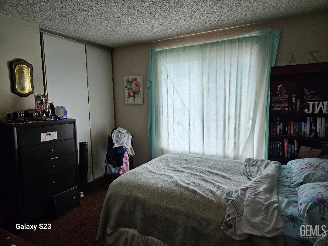 Undisclosed Address San Jose, CA 95111 - Photo 5 of 9 a bedroom with a bed and cabinets