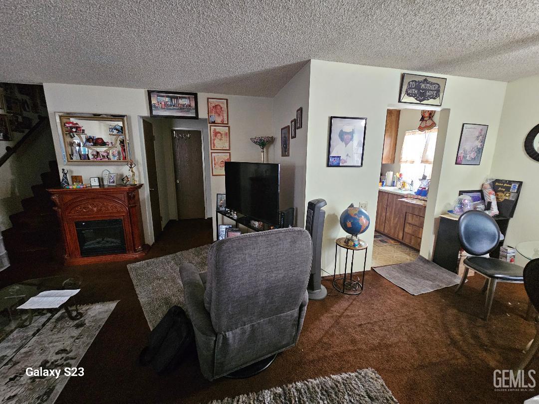 Undisclosed Address San Jose, CA 95111 - Photo 7 of 9 a living room with furniture and a flat screen tv