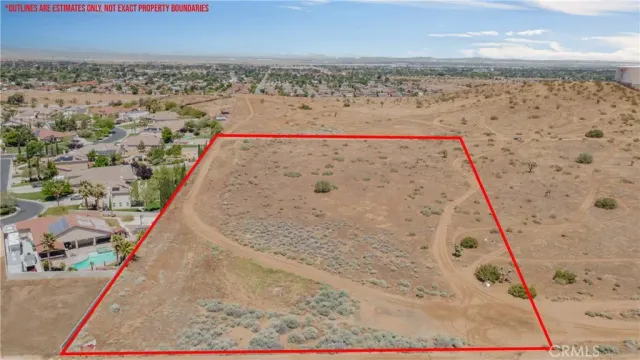 a view of a dry yard covered with snow