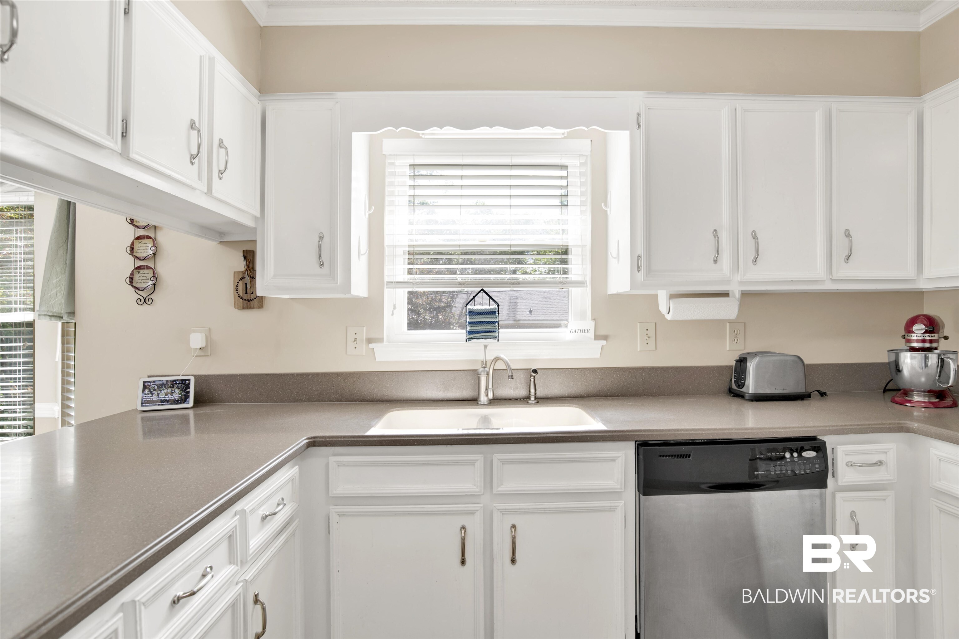 7431 Summer Court Mobile, AL 36695 - Photo 13 of 37 Kitchen with dishwasher, a sink, white cabinets, and ornamental molding