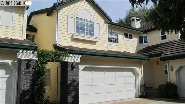 1261 Shell Circle Clayton, CA 94517 - Photo 1 of 1 a yellow house with a outdoor space