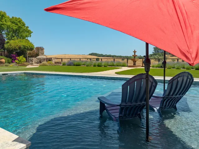 a view of a chairs and table on the wooden floor