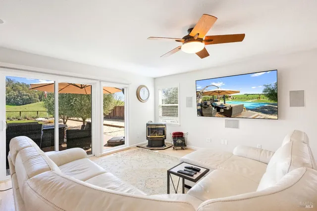 a kitchen with stainless steel appliances kitchen island granite countertop a stove and a refrigerator