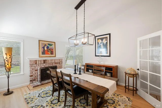 a bedroom with a large bed and a flat tv screen on dresser