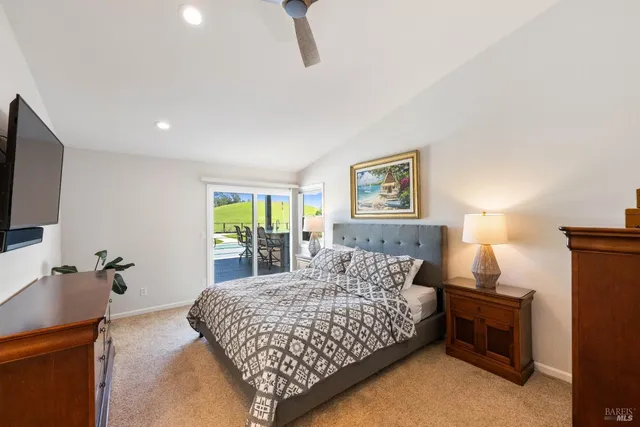 a bedroom with bed and a night stand