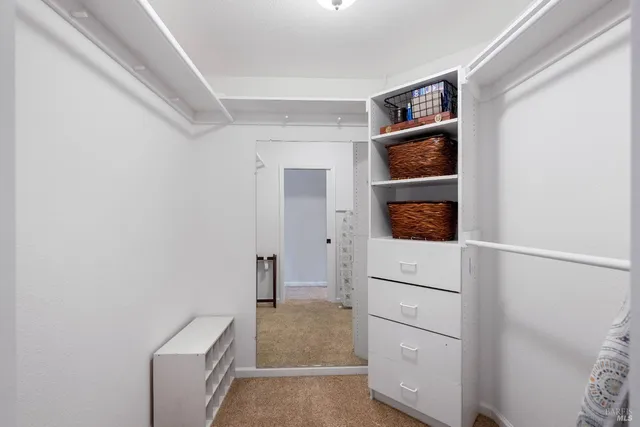 a view of a patio with a table and chairs