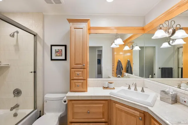a view of a patio with a table and chairs