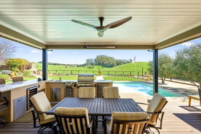 an aerial view of a house with a swimming pool