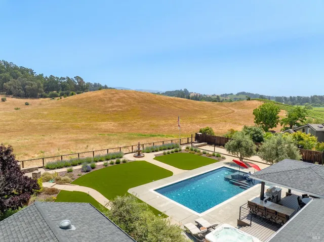 a view of pool with outdoor seating