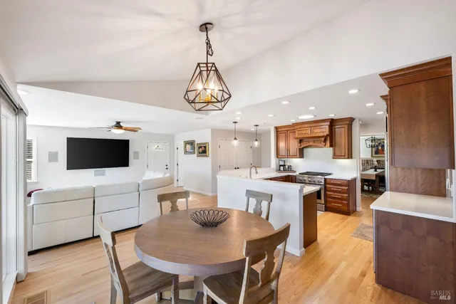 a view of a dining room with furniture window and wooden floor