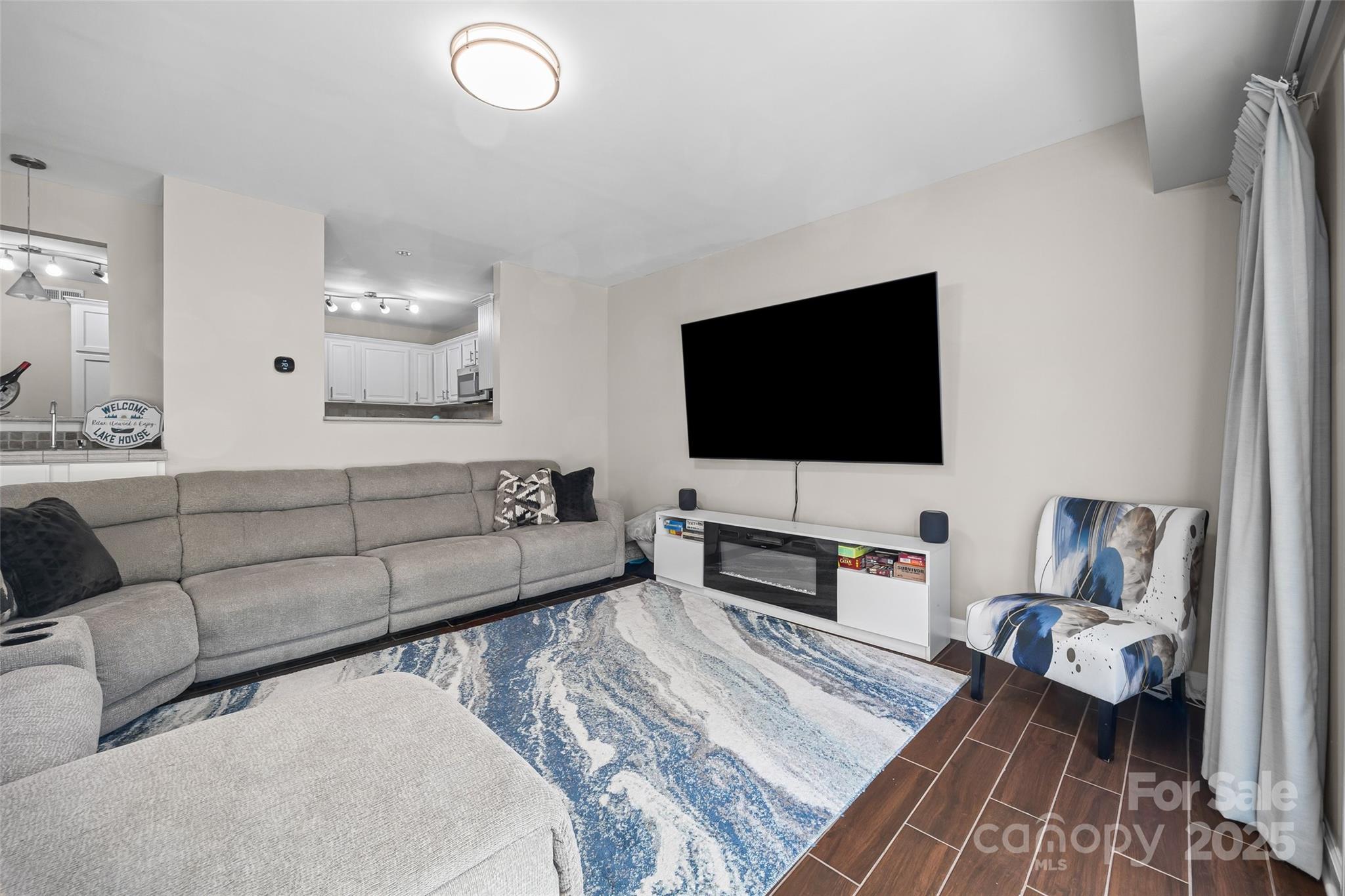 26003 Morningside Drive Fort Mill, SC 29708 - Photo 11 of 37 a living room with furniture and a flat screen tv