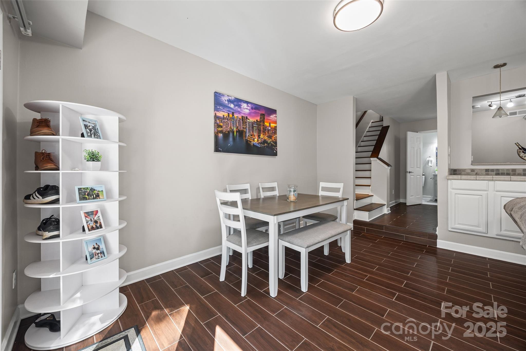 26003 Morningside Drive Fort Mill, SC 29708 - Photo 13 of 37 a dining room with furniture a rug and wooden floor