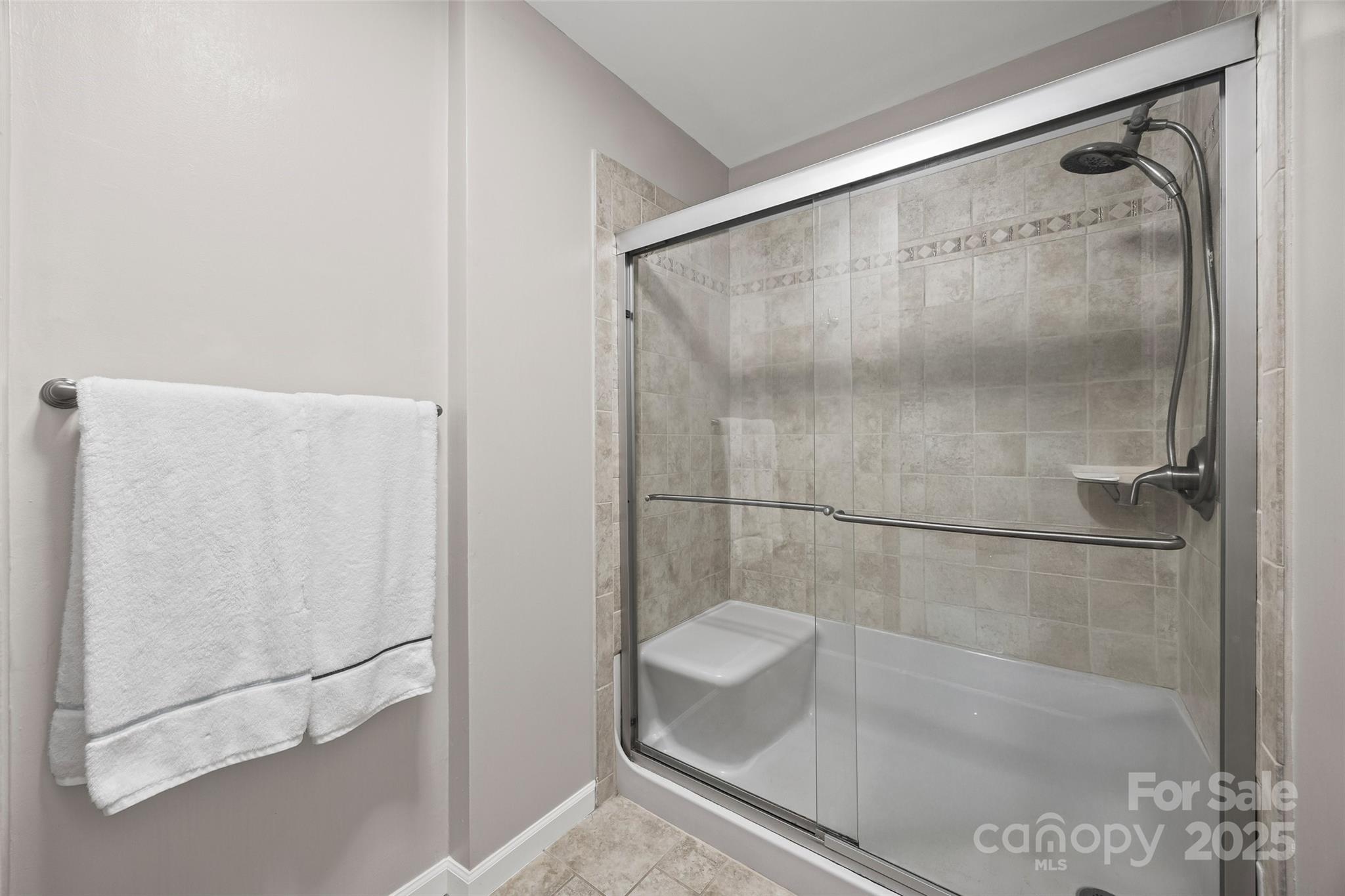 26003 Morningside Drive Fort Mill, SC 29708 - Photo 19 of 37 a bathroom with a glass shower door