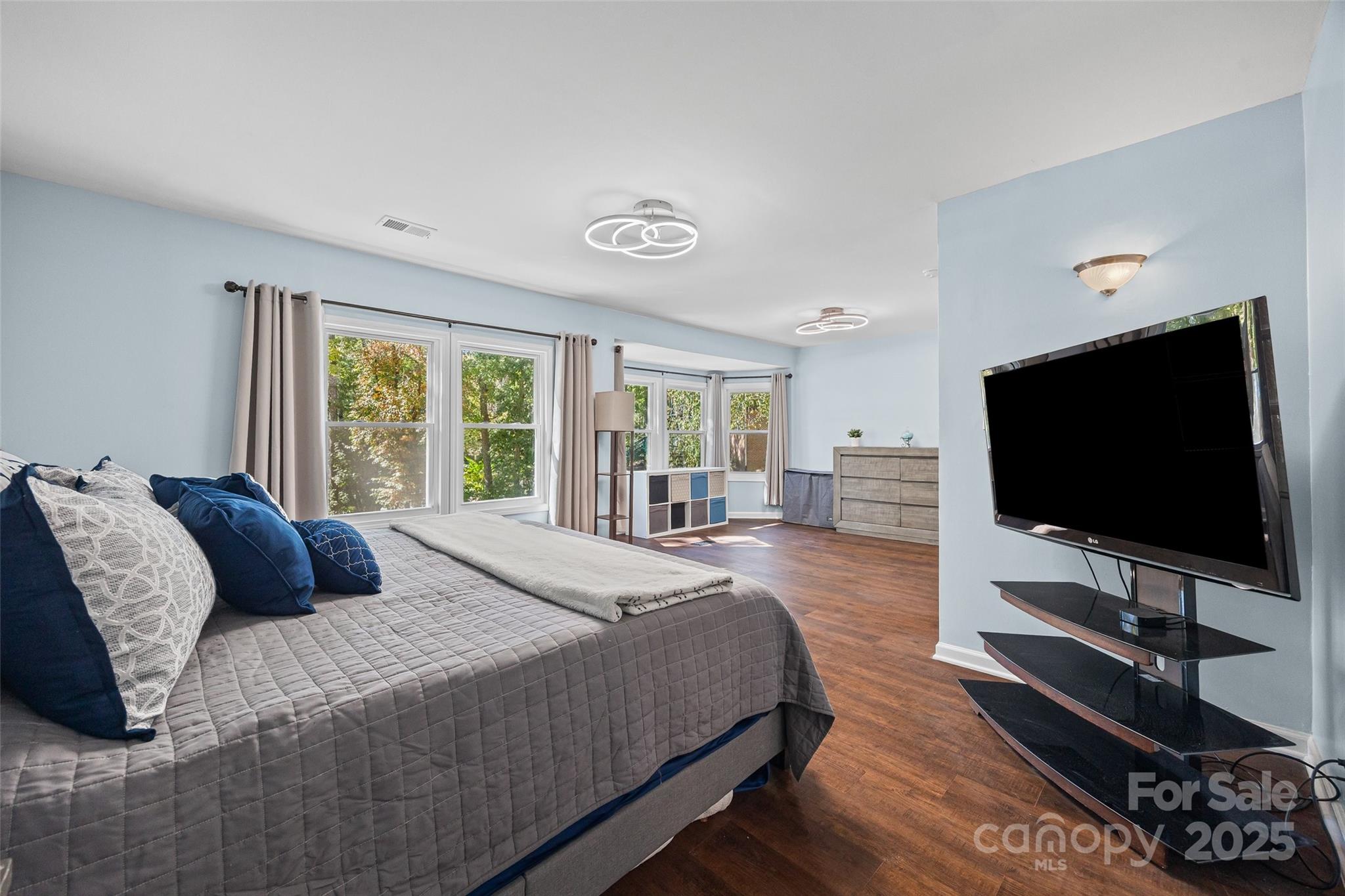 26003 Morningside Drive Fort Mill, SC 29708 - Photo 4 of 37 a bedroom with a large bed and a flat screen tv