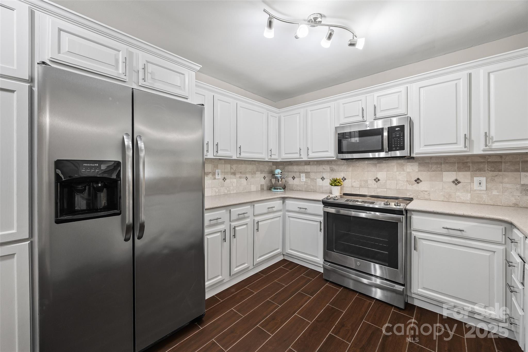 26003 Morningside Drive Fort Mill, SC 29708 - Photo 6 of 37 a kitchen with a refrigerator stove and microwave