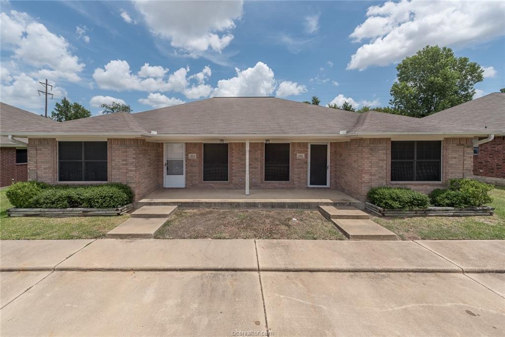 1715 Rock Hollow Loop Bryan, TX 77807 - Photo 1 of 13 a view of a house with a yard