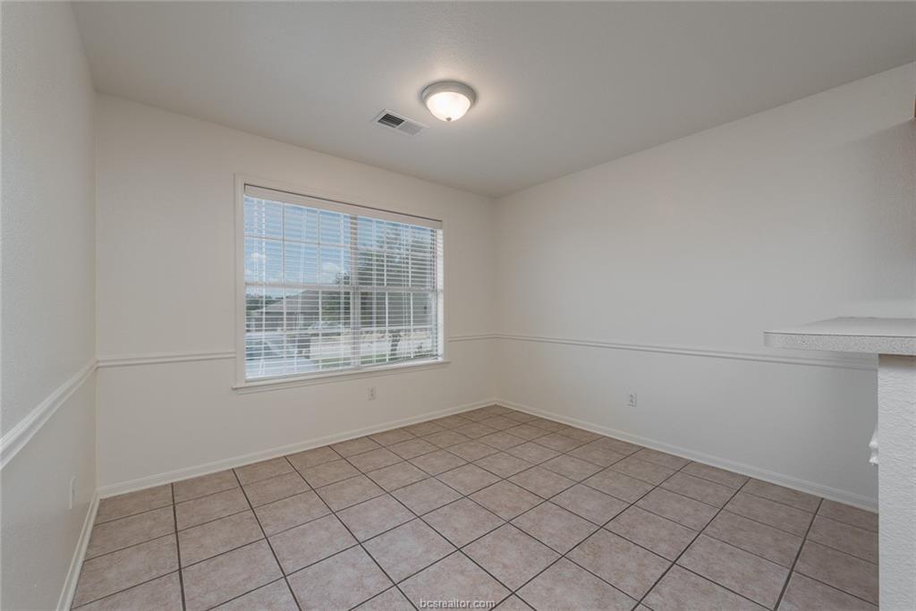 1715 Rock Hollow Loop Bryan, TX 77807 - Photo 5 of 13 a view of an empty room with a window
