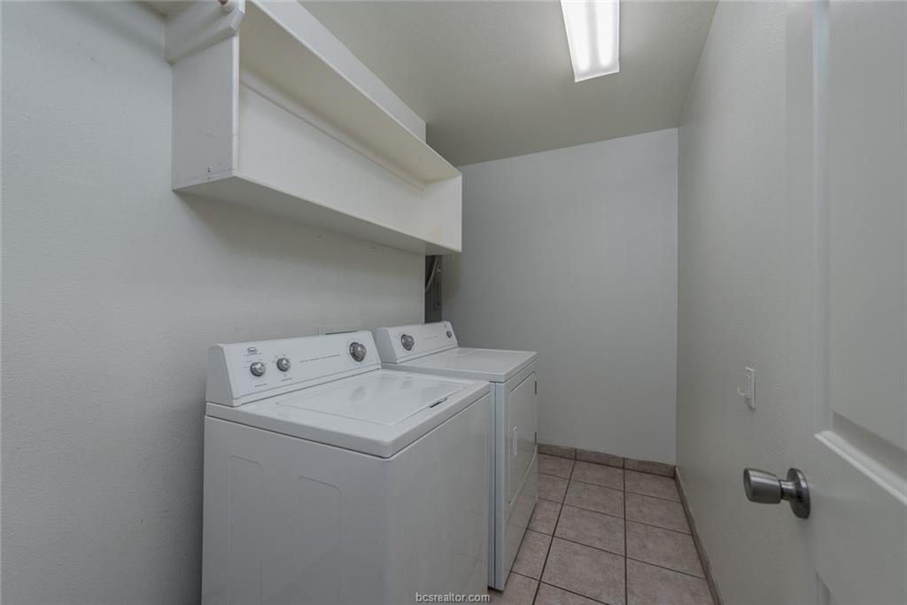 1715 Rock Hollow Loop Bryan, TX 77807 - Photo 6 of 13 a utility room with dryer and washer