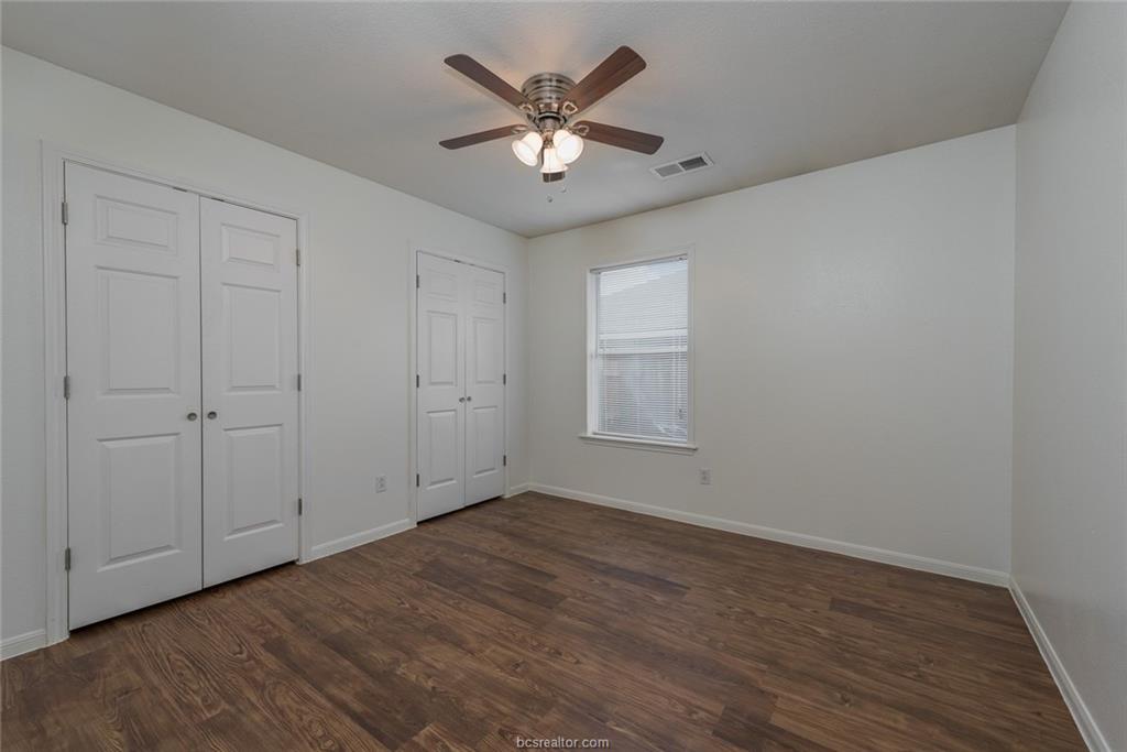 1715 Rock Hollow Loop Bryan, TX 77807 - Photo 8 of 13 a view of an empty room with wooden floor