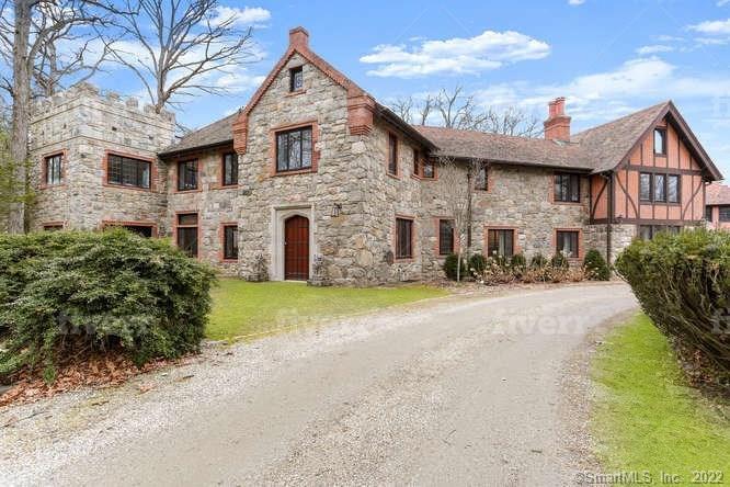 Long winding driveway brings you to the entrance of the 1920s stone home. This hidden treasure sits in the middle of highly sought after Old Hill neighborhood.