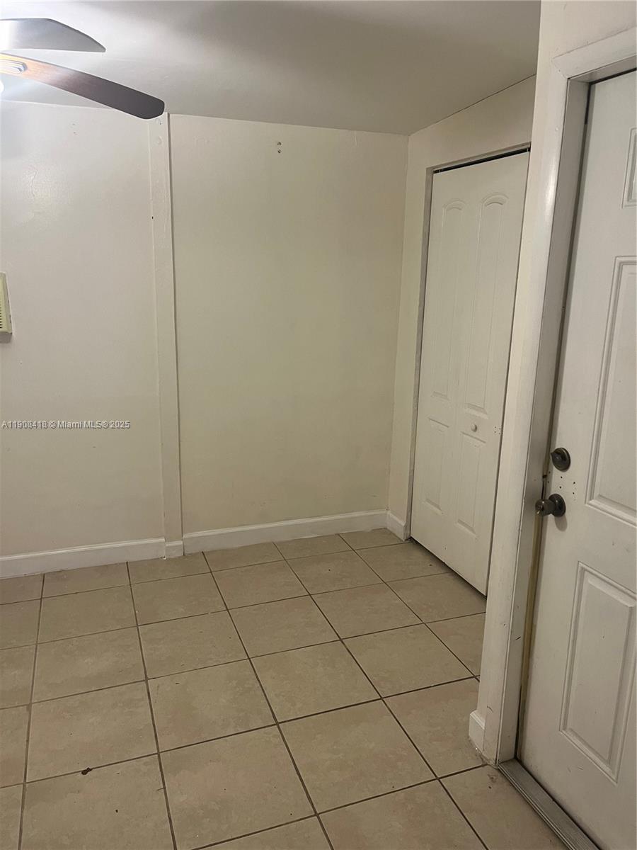 2255 West 55th Street, Unit 2 Hialeah, FL 33016 - Photo 11 of 13 a view of an empty room with wooden floor