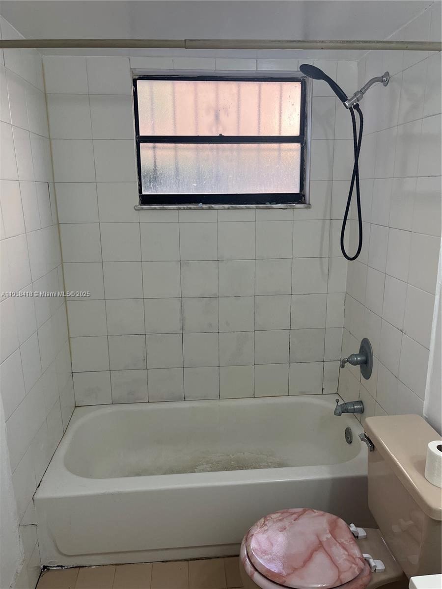 2255 West 55th Street, Unit 2 Hialeah, FL 33016 - Photo 3 of 13 a bathroom with a toilet bathtub and shower