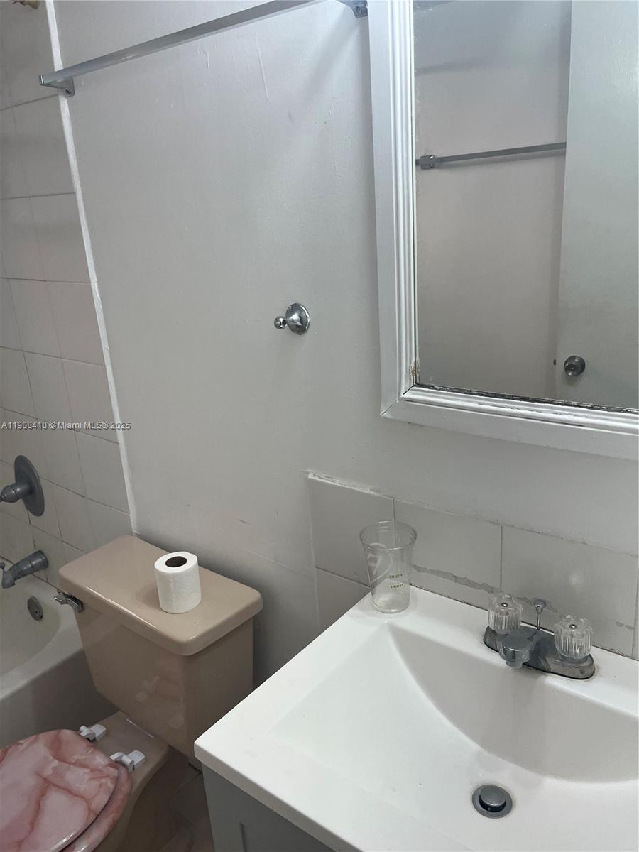 2255 West 55th Street, Unit 2 Hialeah, FL 33016 - Photo 5 of 13 a bathroom with a sink and a toilet