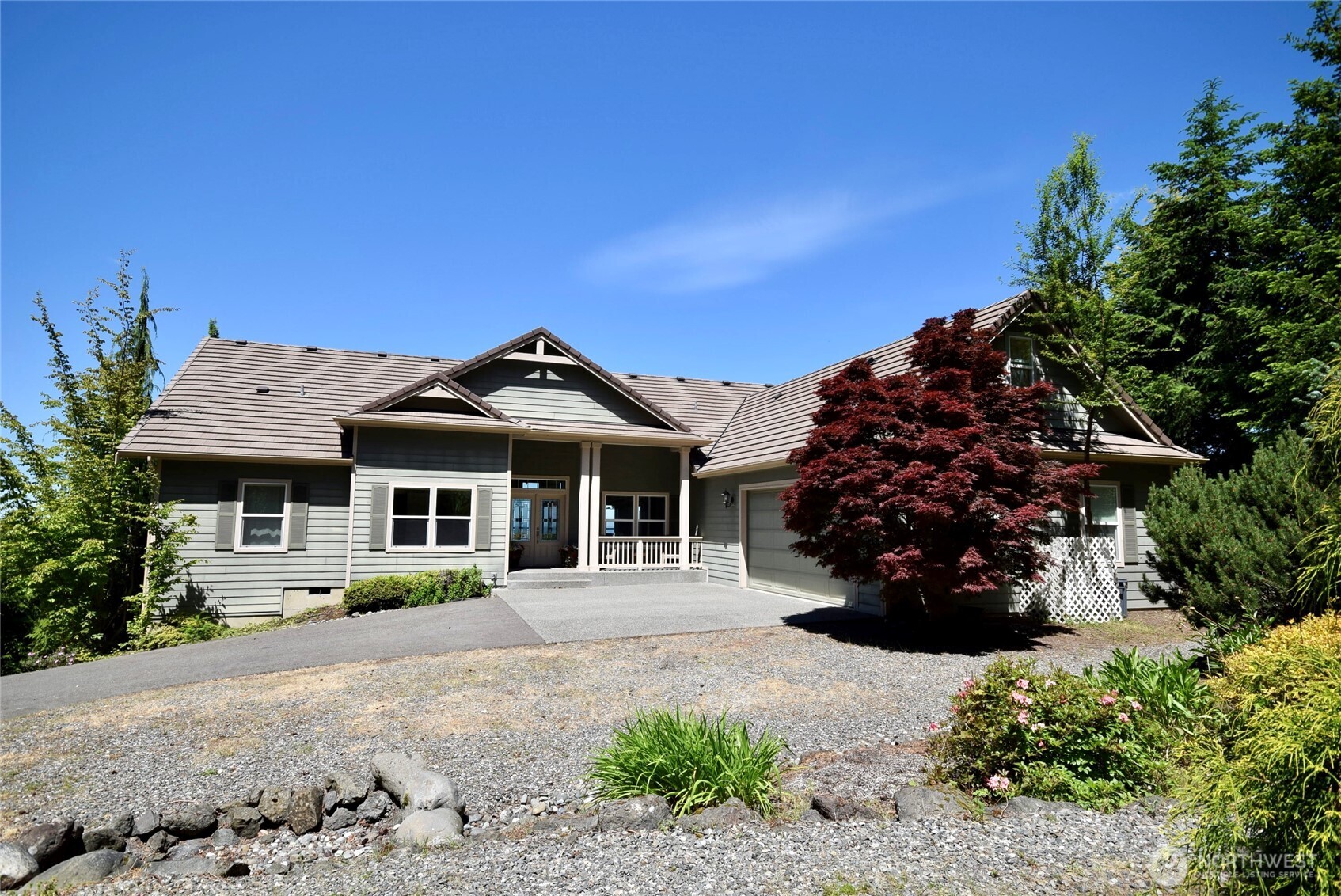 603 Owls Nest Road Sequim, WA 98382 - Photo 3 of 32 a front view of a house with garden